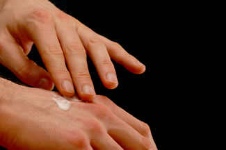 Using topical analgesics to relieve hand and knuckle pain.