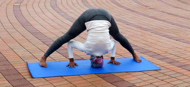 Beautiful Yoga: Wide Legged Forward Bend Pose - Real senior woman doing  Prasarita Padottanasana exercise Stock Photo - Alamy